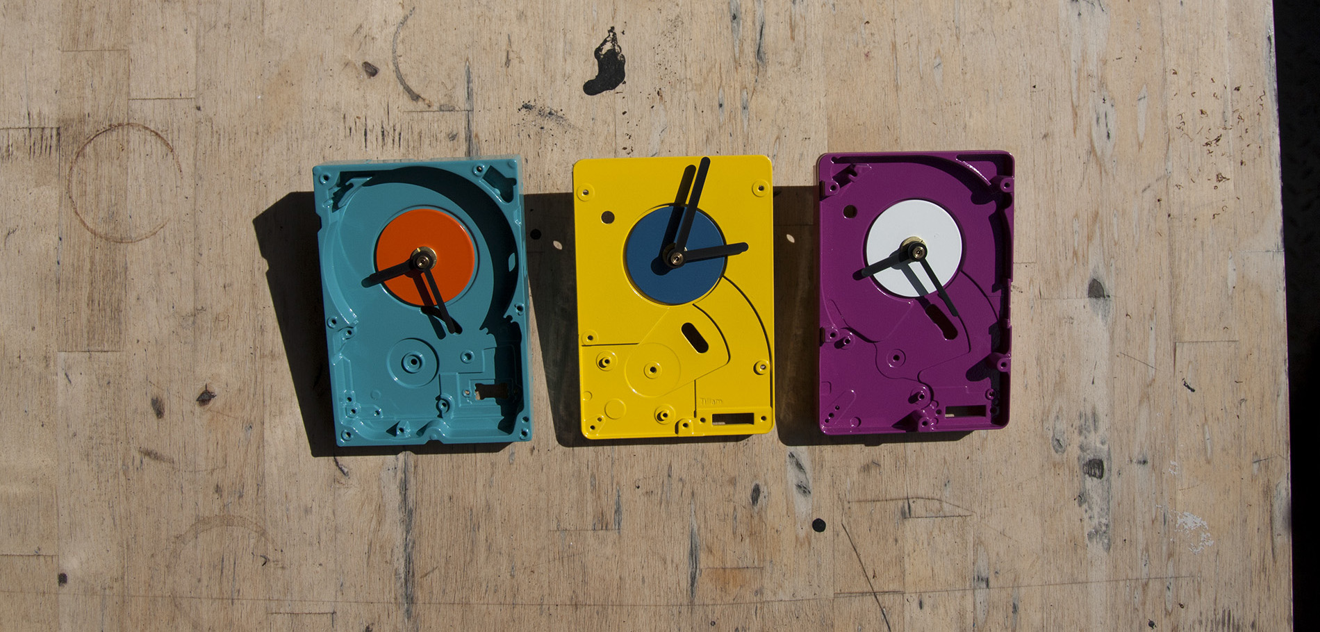 Tillam - time and light - colorful clocks on a table